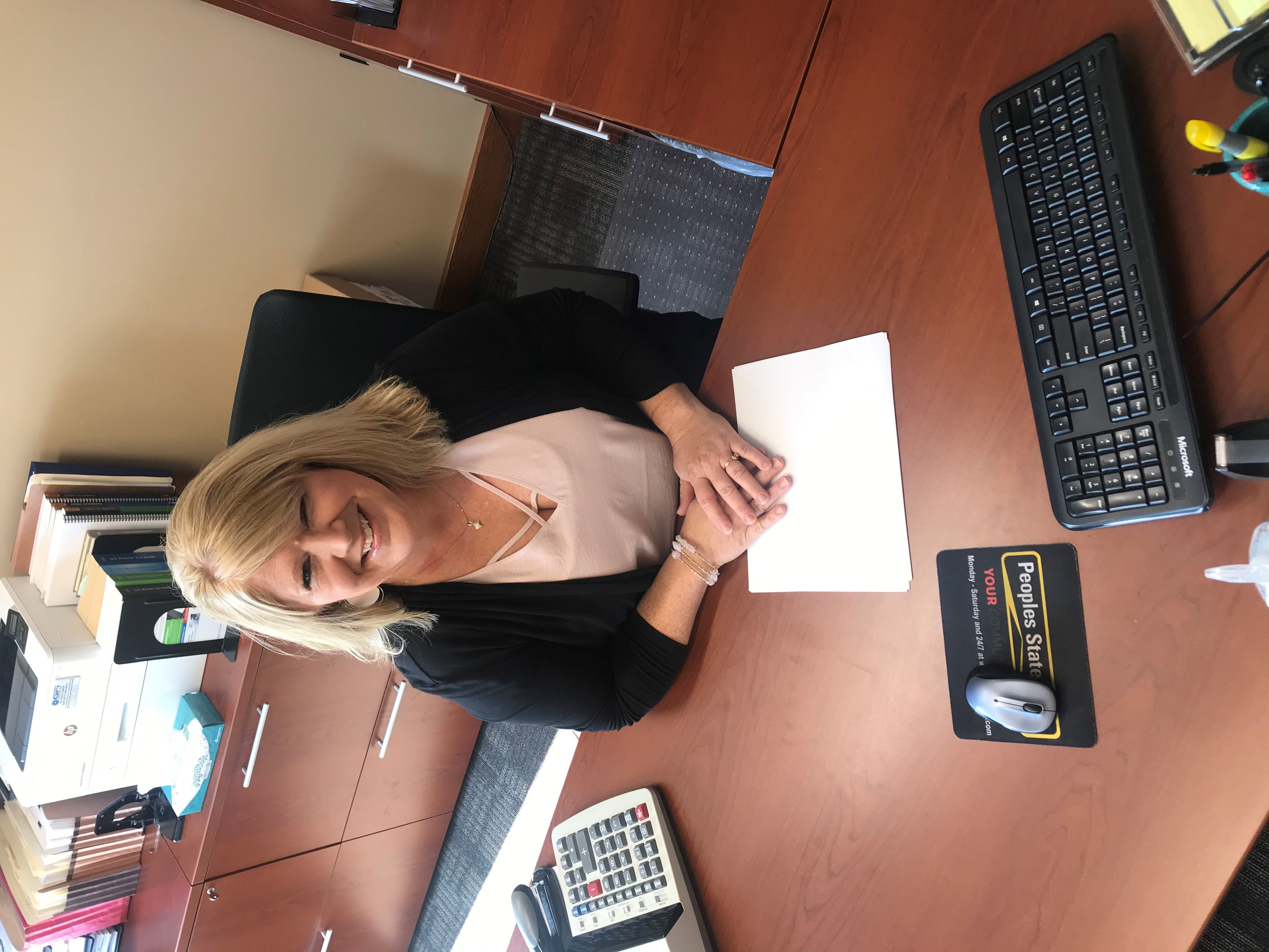 Karla Koebele at her desk